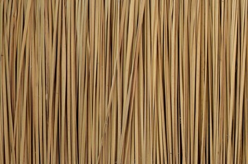 Background and texture photo of traditional asian house's Thatched wall or fence or roof that made from blady grass. - obrazy, fototapety, plakaty