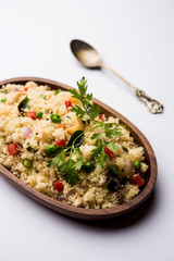Rava Upma / Uppuma - south indian breakfast served in a bowl. selective focus