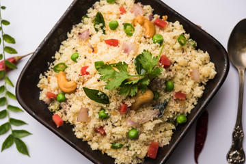 Rava Upma / Uppuma - south indian breakfast served in a bowl. selective focus