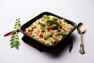 Rava Upma / Uppuma - south indian breakfast served in a bowl. selective focus