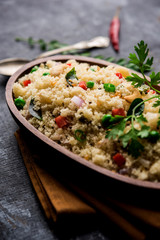 Rava Upma / Uppuma - south indian breakfast served in a bowl. selective focus