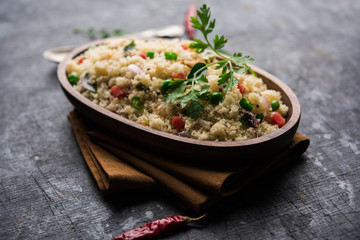 Rava Upma / Uppuma - south indian breakfast served in a bowl. selective focus