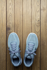 Running sport shoes on wooden background Top View with copy space.