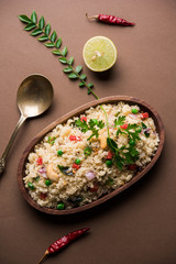 Rava Upma / Uppuma - south indian breakfast served in a bowl. selective focus