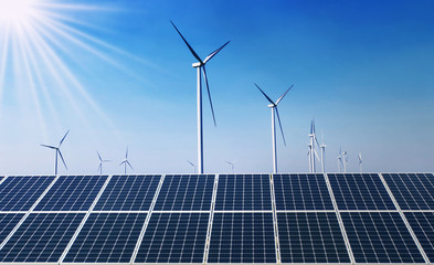 concept clean energy power in nature. solar panel with wind turbine and blue sky background