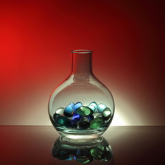 Glass bottles filled with glass balls