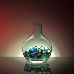 Glass bottles filled with glass balls