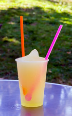 Tropical cocktails fruits juice drinking straws