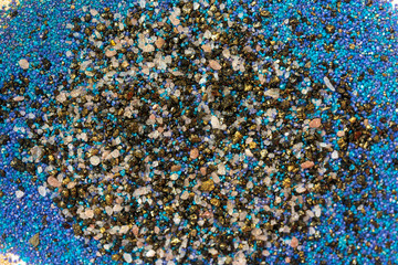 Layered colorful sand pattern. Marble style background. Blue and gold powder texture.
