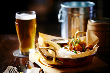 Fried potato, fried chicken with glass of beer 
