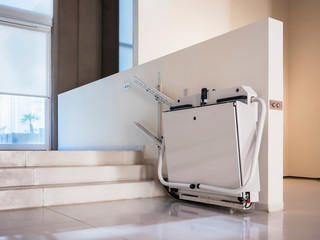 Disability stairs lift facility indoor building Wheelchair elevator © VTT Studio
