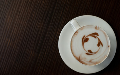 cup of coffee on wooden table