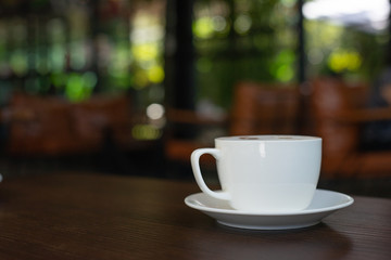 cup of coffee on wooden table