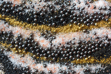 Layered colorful sand pattern. Marble style background. Black and gold powder texture.