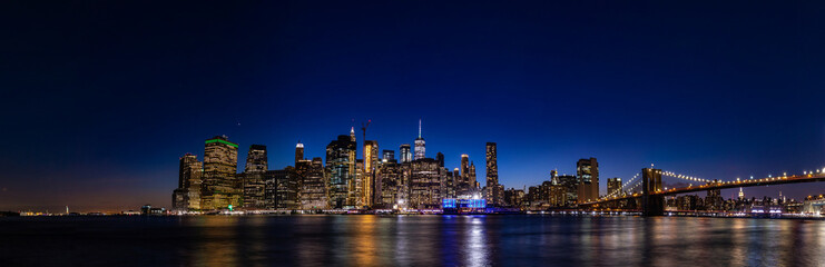 New York city skyline at night - panorama of Lower Manhattan from Brooklyn heights park