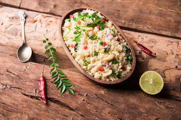 Rava Upma / Uppuma - south indian breakfast served in a bowl. selective focus
