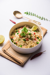 Rava Upma / Uppuma - south indian breakfast served in a bowl. selective focus
