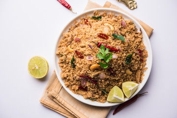 Rava Upma / Uppuma - south indian breakfast served in a bowl. selective focus