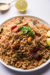 Rava Upma / Uppuma - south indian breakfast served in a bowl. selective focus