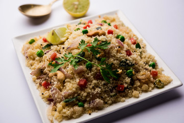 Rava Upma / Uppuma - south indian breakfast served in a bowl. selective focus