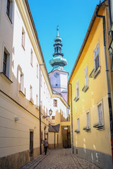 Fototapeta na wymiar narrow cobbled street leading to the temple in the Slovak city of Bratislava