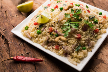Rava Upma / Uppuma - south indian breakfast served in a bowl. selective focus