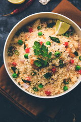 Rava Upma / Uppuma - south indian breakfast served in a bowl. selective focus
