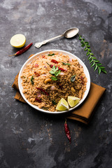 Rava Upma / Uppuma - south indian breakfast served in a bowl. selective focus