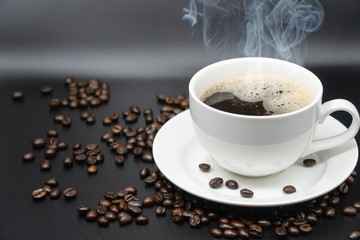 White cup of coffee on background