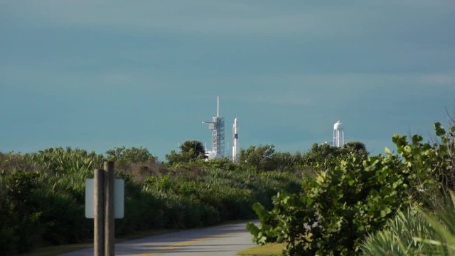 Rocket blasts off from launch pad at Kennedy Space Center.  Wide angle with audio.