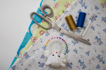 set for sewing different fabric products on a light background