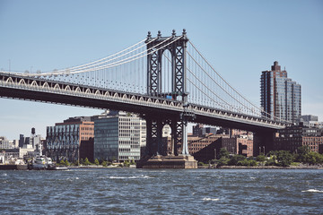 Fototapeta na wymiar Manhattan Bridge and Brooklyn borough, color toned picture, New York, USA.