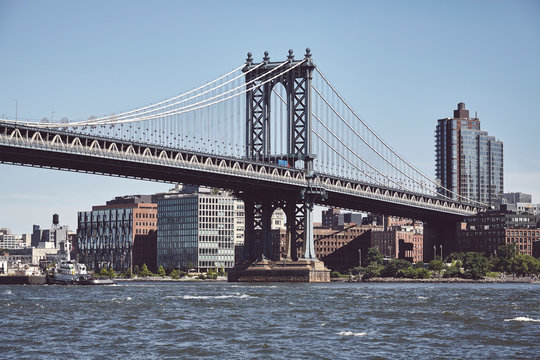 Manhattan Bridge and Brooklyn borough, color toned picture, New York, USA.