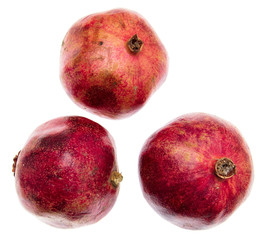 Ripe red pomegranates isolated on white background