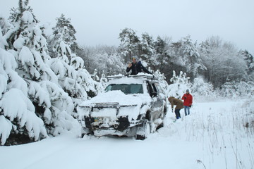 Winter offroad. Expedition to the top of the mountain. Snowy summits. Machines are stuck in the snow. Ukraine. Carpathians