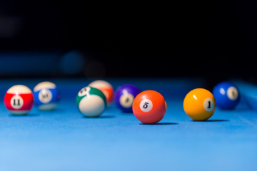 Billiard balls on pool blue table - sport background