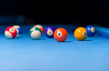 Colorful billiards balls. Billiard ball at blue table. Colorful