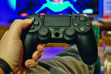 Gamepad in hand close up view