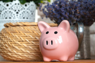 Piggy Bank on the Wooden Table
