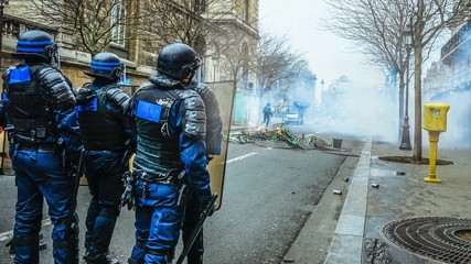 Riot police at protest in urban city street Cinemagraph