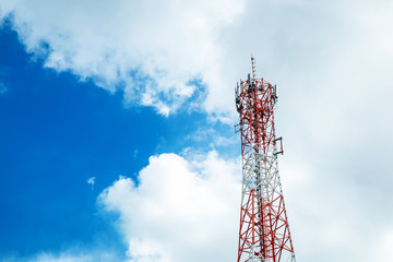 Cell Site Post in the Clear Blue Sky with Clouds.