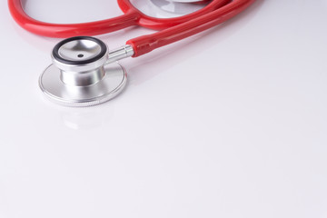 Stethoscope On White Background with selective focus and crop fragment