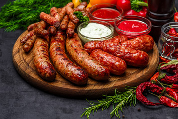 Grilled sausages. Closeup of sausage on the grill. Home-made Sausages. Bavarian sausages
