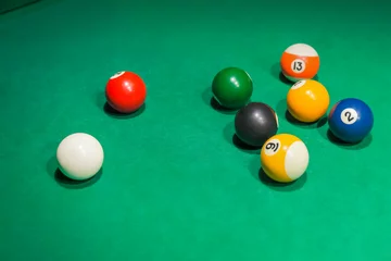 Foto op Plexiglas Billiard balls on pool green table © Nikolai Sorokin