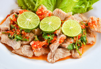 Pork with lemonade / Pork boil with chili and lime lemon sauce with herb and Vegetable on plate