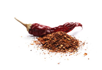 Dry spicy chili peppers and flakes, powder isolated on white background