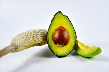 Fresh avocado cut in half with seed.