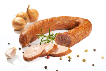 Sausage with herbs and spices on a white background