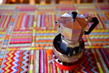 Moka coffee pot to make espresso. Coffee in muslim pattern.
