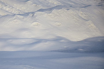 snow drifts in a winter sunny day
